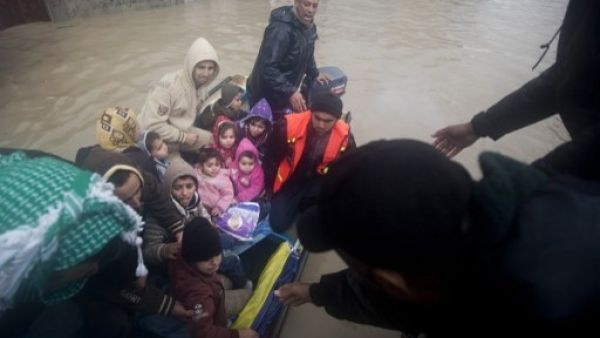 Rescue services have been evacuating thousands of Gazans from their homes due to heavy flooding that has left many homes underwater (Mahmud Hams/AFP)