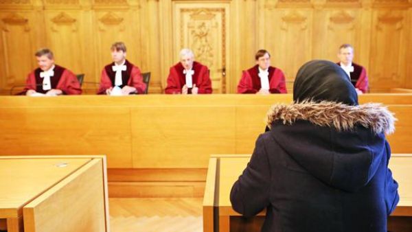School pupil Asma sits in the court room of the Administrative Court of Germany in Leipzig on Wednesday. (AFP)