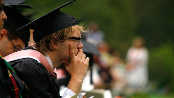 A pensive looking grad student absorbed in his own thoughts.  Maybe carrying the weight of a thesis on his shoulders might 
attract him to prayer.