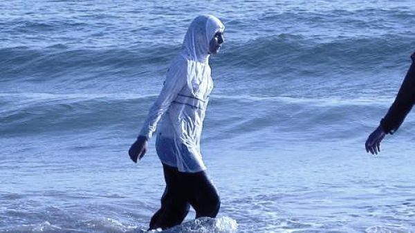 Albania: Where 'burkinis' and bikinis blend to bathe. Albania: Where 'burkinis' and bikinis blend to bathe.