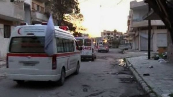 صورة من التلفزيون الرسمي السوري السبت 25 شباط/فبراير تظهر سيارات اسعاف تابعة للهلال الاحمر في مدينة حمص 
