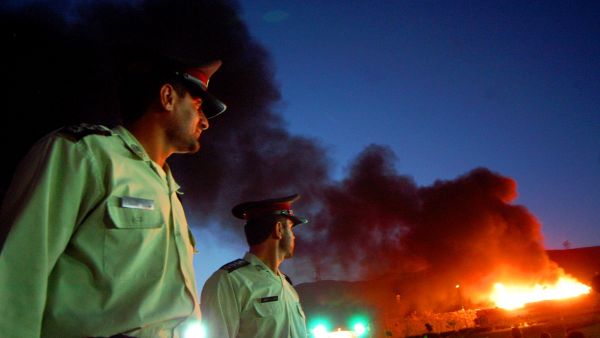 Drug police: Burning drugs in Iran in the attempt to wipe out the drug invasion from neighbor Afghanistan.