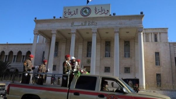 Officials held a funeral procession on Sunday for Mohammed Al Karoui, one of the soldiers who was killed in the Anbar operation Saturday (STR/AFP)