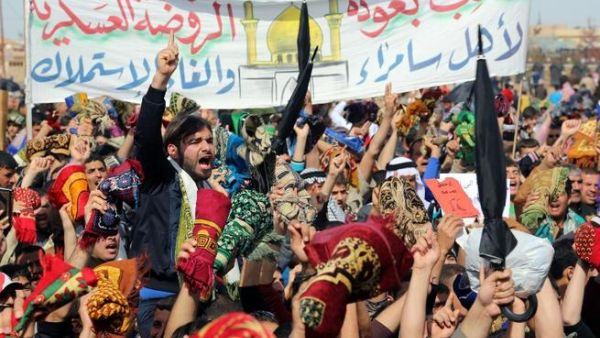 Iraqi protestors shout slogans during a demonstration in the Iraqi city of Samarra in early March demanding the ousting of Prime Minister Nouri al-Maliki. (AFP PHOTO / MAHMOUD AL-SAMARRAI)