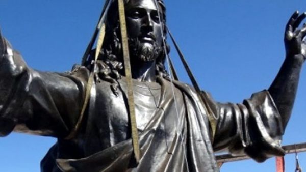 Workers put the finishing touches on erecting a statue of Jesus atop the Cherubim mountain in Syria.