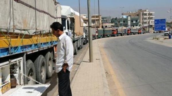 Dozens of trucks line up at the Lebanese-Syrian border in Masnaa.
