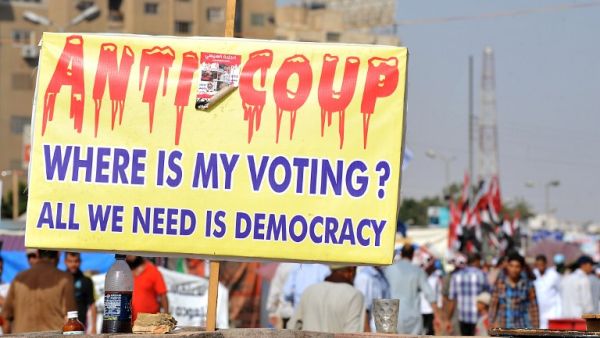 Protestors walk in Cairo on August 2. Egyptian security forces are threatening to blockade a main protest camp.  AFP / FAYEZ NURELDINE