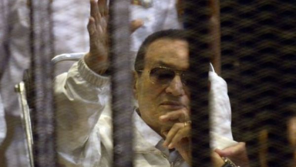Hosni Mubarak waves to supporters during a court appearance in April (AFP)