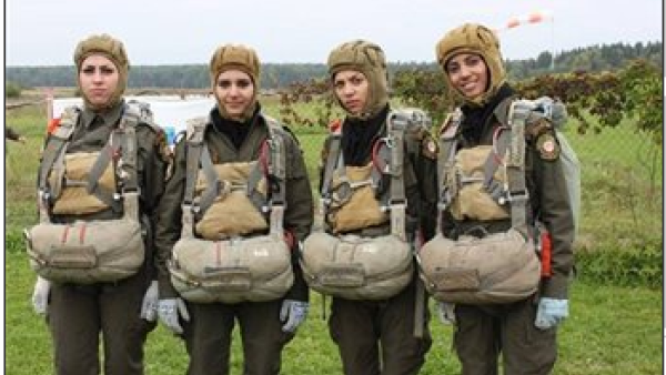 The Palestinian beauties (some looking happier than others) show off their paratrooper uniforms (Image courtesy of Maan News Agency)
