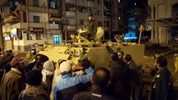 Egyptian protestors shout at a soldier standing in an armored personnel carrier as they demonstrate in the streets of the canal city of Port Said in late January (Photo: AFP / STR)