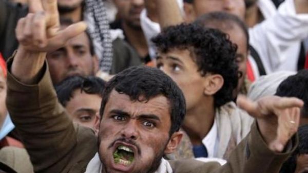A Yemeni man chewing qat during a protest.