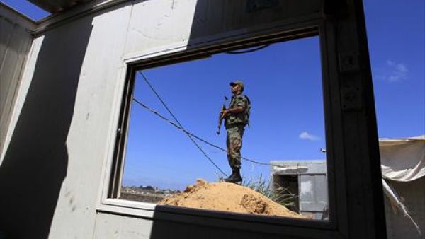 A Hamas policeman stands guard along the border with Egypt and the Palestinian territory on September 8, 2013 in the southern Gaza Strip city of Rafah. The Egyptian army has launched a major offensive against militants in the area. (AFP)