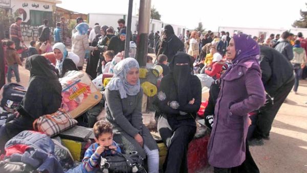 Syrian refugees wait near the Kingdom's northern border upon their arrival. 'The Voice' project provides Syrians in Jordan with the opportunity to tell their stories and voice their concerns (JT file photo)