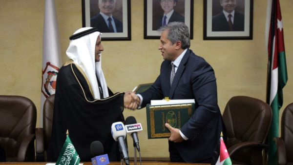 Jordan's then-Planning Minister Jafar Hassan signed a deal with the Saudi Fund for Development in February 2013 for development-related projects (Courtesy of the Jordan Times)