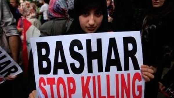 Is America really only limited to signs and banners to stop Bashar Assad?