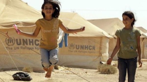 Syrian refugee children play at the Zaatari refugee camp close to the Jordanian city Mafraq, near the border with Syria Syrian refugee children play at the Zaatari refugee camp close to the Jordanian city Mafraq, near the border with Syria