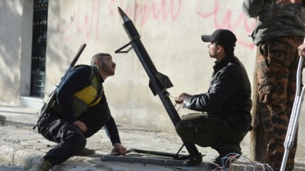 Syrian rebels fire a mortar towards regime forces stationed at Kwiriss airport in Al-Bab, 30 kilometres from the northeastern Syrian city of Aleppo, on Thursday. (AFP Photo/Edouard Elias)