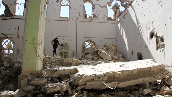A man stands in the rubble of the Othman mosque, in Syria's eastern town of Deir Ezzor, on July 24. AFP / KARAM JAMAL