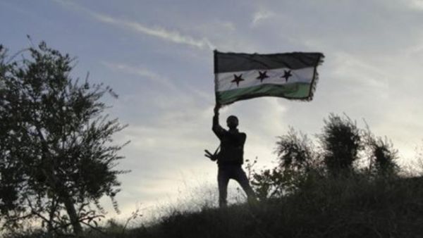 A Lebanese judge has issued an arrest warrant for a defected Syrian army colonel after he admitted to attempting to form an anti-Assad rebel brigade in north Lebanon. (AFP/File)