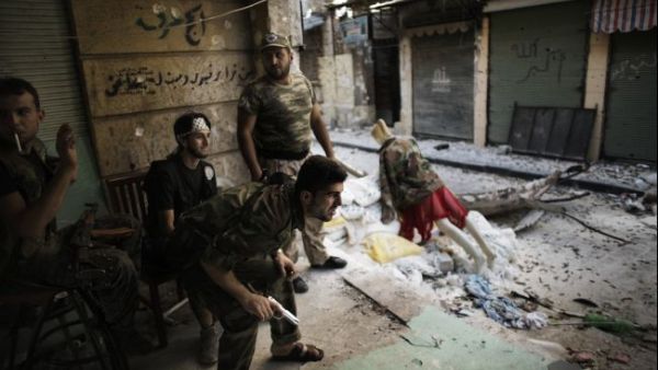 Free Syria Army fighters man a position in the city of Aleppo on Sept. 16, 2012. [AFP]