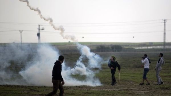 Israel fired tear gas at Palestinian protestors at a demonstration near the border earlier this week (Mohammed Abed/AFP)