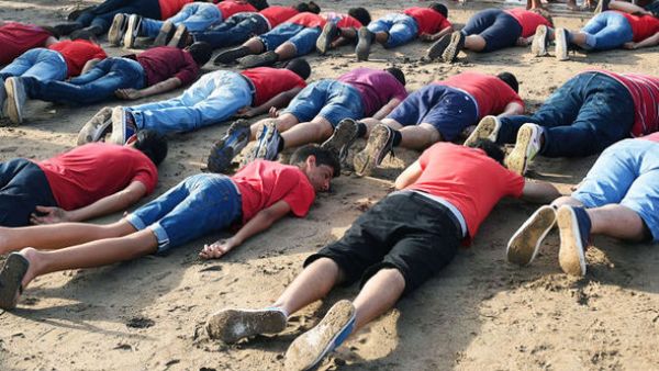 About 30 people in Rabat, Morocco pay a tribute to Aylan Kurdi, a Syrian boy who was found dead on the Turkish shore. (AFP/File)