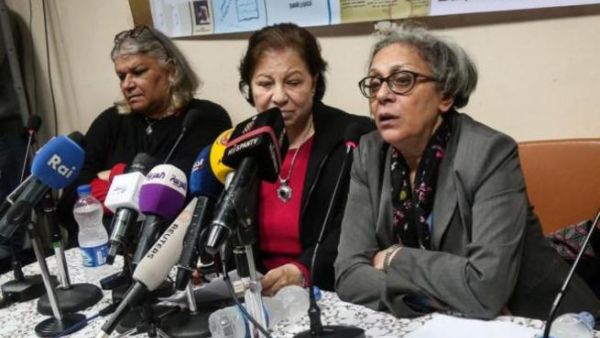 Seif el-Dawla , Suzan Fayyad, center, and Magda Adly, right, co-founder of El Nadeem Center for Rehabilitation of Victims of Violence, hold a press conference in Cairo, Sunday, Feb. 21, 2016. (AFP/Mohamad El Raai)