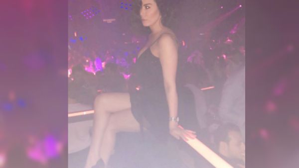 Nadine Al-Rassi posted a photo of herself in a nightclub wearing a very short dress. (Source: nadinealrassi - Instagram)