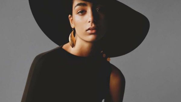 Nora Attal turned heads in a black gown and accessorized her look with chunky gold jewelry (Source: noraattal - Instagram)