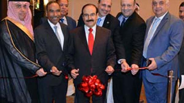 Dr Mirza opens the office, watched by other officials. Image: courtesy BNA.
