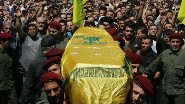 Hezbollah supporters rally during a funeral for one of their members in Beirut. (AFP/File)