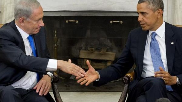 US President Barack Obama (R) and Israeli Prime Minister Benjamin Netanyahu shake hands during a meeting in the Oval Office of the White House. (Image Credit: AFP)