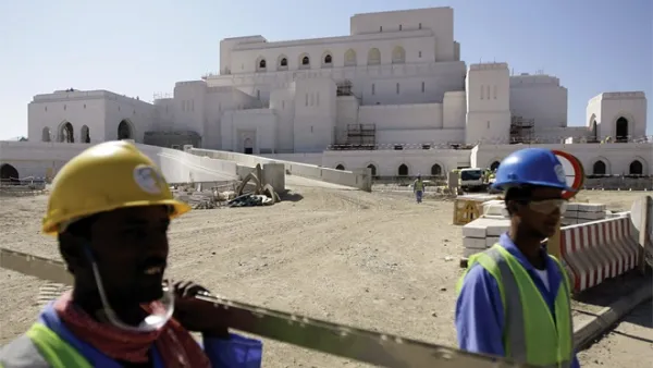 Foreign laborers working in road construction in Oman. (AFP)