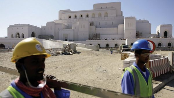 Foreign laborers working in road construction in Oman. (AFP) Foreign laborers working in road construction in Oman. (AFP)