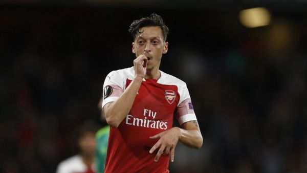 The German playmaker continues to split opinion, but a former Gunners team-mate has hailed his qualities and called for a sense of perspective