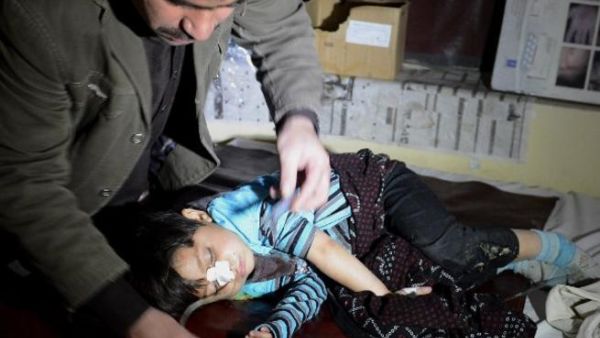 A Pakistani paramedic treats an injured child following a grenade attack on a polio vaccination team in Quetta. [AFP]