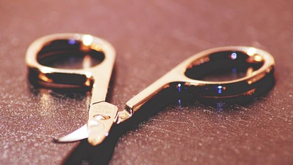 The accused picked up a pair of scissors and stabbed his brother several times on the right side of his head, causing severe bleeding, and eventual death.