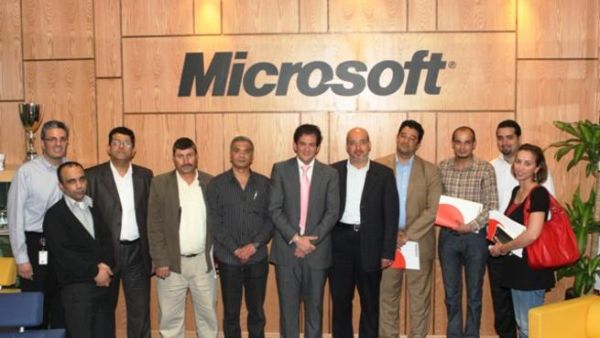 Microsoft Jordan team members group around Husni Khuffash Microsoft Jordan team members group around Husni Khuffash