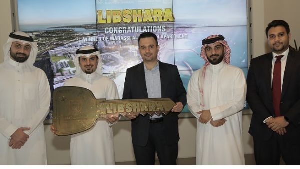 The winner with Mr. Subah Al Zayani and representatives from KFH-Bahrain and Marassi Al Bahrain The winner with Mr. Subah Al Zayani and representatives from KFH-Bahrain and Marassi Al Bahrain
