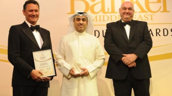 Abdulla Al-Najran Al-Tuwaijri, NBK’s Deputy Group General Manager, receives the award from Banker Middle East