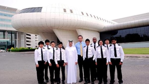 The first class of the EASA Licensed ATPL Pilot Training programme in their new uniforms with Dr. Ahmad Al Ali