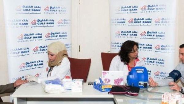 Gulf Bank employees during a blood test which occurs before donating blood