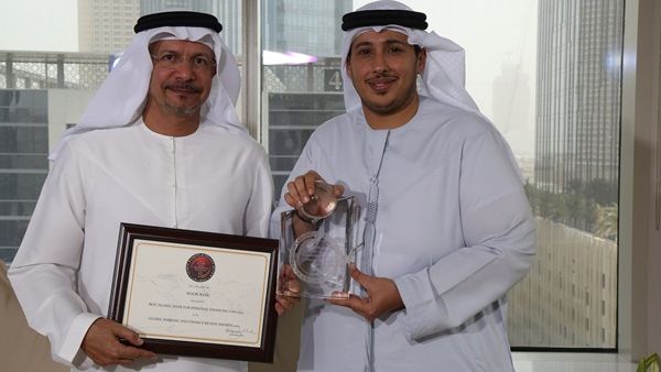 Hussain Al Qemzi, CEO Noor Bank and Waleed Barhaji, Business Head of Consumer Finance, Noor Bank, with the awards at the bank’s headoffice in Dubai