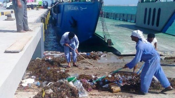 ADPC workers in action cleaning the Mugharrag Port in the Western Region ADPC workers in action cleaning the Mugharrag Port in the Western Region