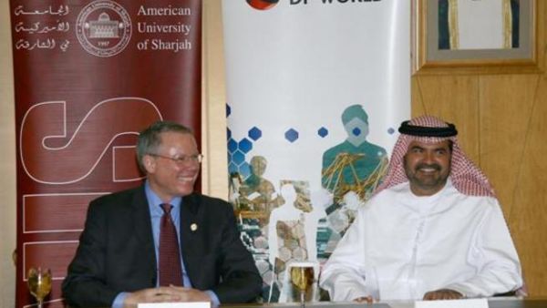 Mohammed Al Muallem and Dr. Peter Heath at the signing ceremony