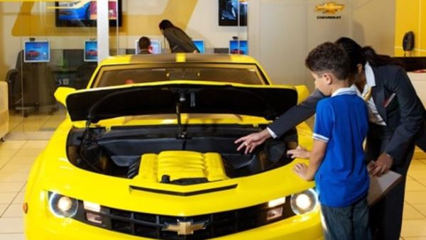 A child learning about the Chevrolet Camaro's features at Kidzania A child learning about the Chevrolet Camaro's features at Kidzania