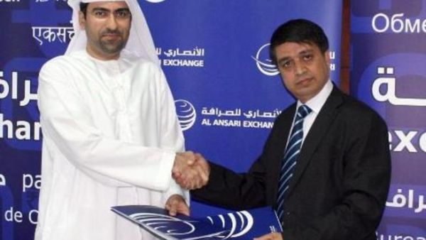 Chandra Prasad Dhakal, Executive Chairman of International Money Express and Rashed Ali Al Ansari, General Manager of Al Ansari Exchange taken after signing the agreement.