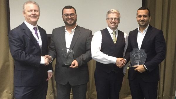 Ammar Al Ketbi and Abdulla Salmeen from Zain Bahrain receiving the awards
