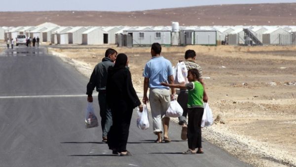 The center will allow Syrian refugees to obtain a one-month leave from the camp and work permit to pursue job opportunities outside the camp. (AFP/ File) The center will allow Syrian refugees to obtain a one-month leave from the camp and work permit to pursue job opportunities outside the camp. (AFP/ File)