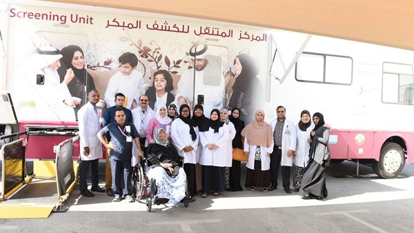 Volunteers pose for photos during the screening program